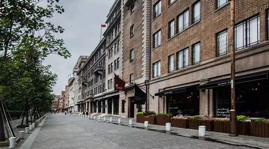 Street view of the Lyceum Building in Rockbund, Shanghai, showing the historic building and its surrounding urban context.