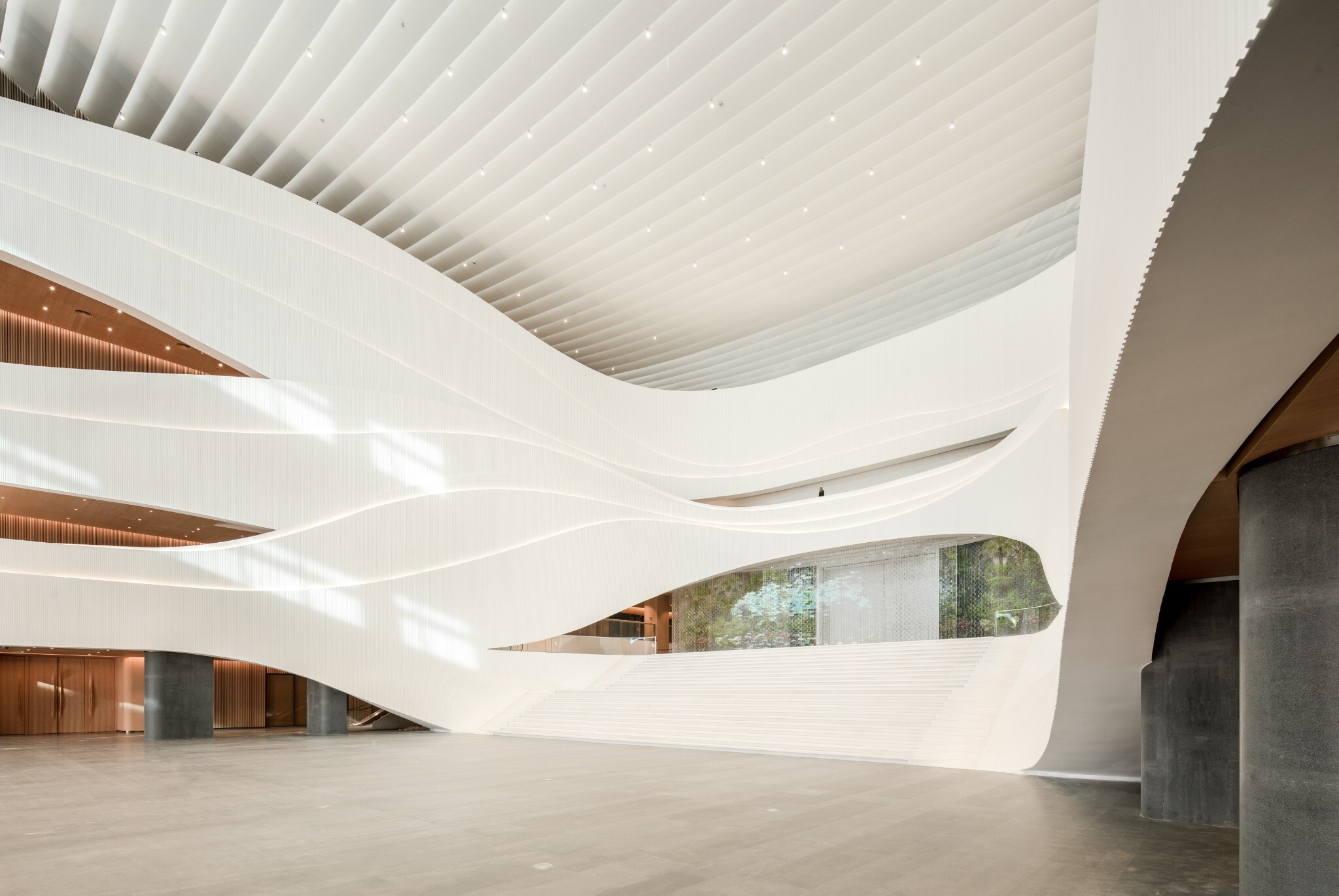 Rendering of the connection between the West Wing Art Museum atrium and galleries, showing the central public space, gallery entrances, and skylight zone above.