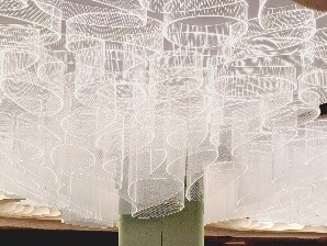 Detail of layered acrylic lighting, showing curved forms and translucent material quality.