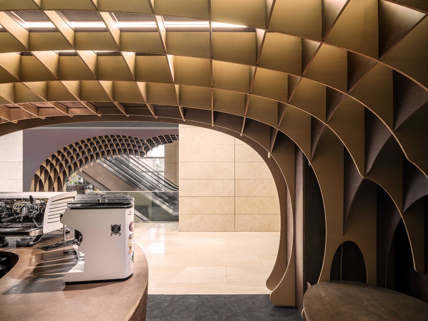 View from the boundary between corridor and store, where dark and light materials shift visually with the viewing angle.