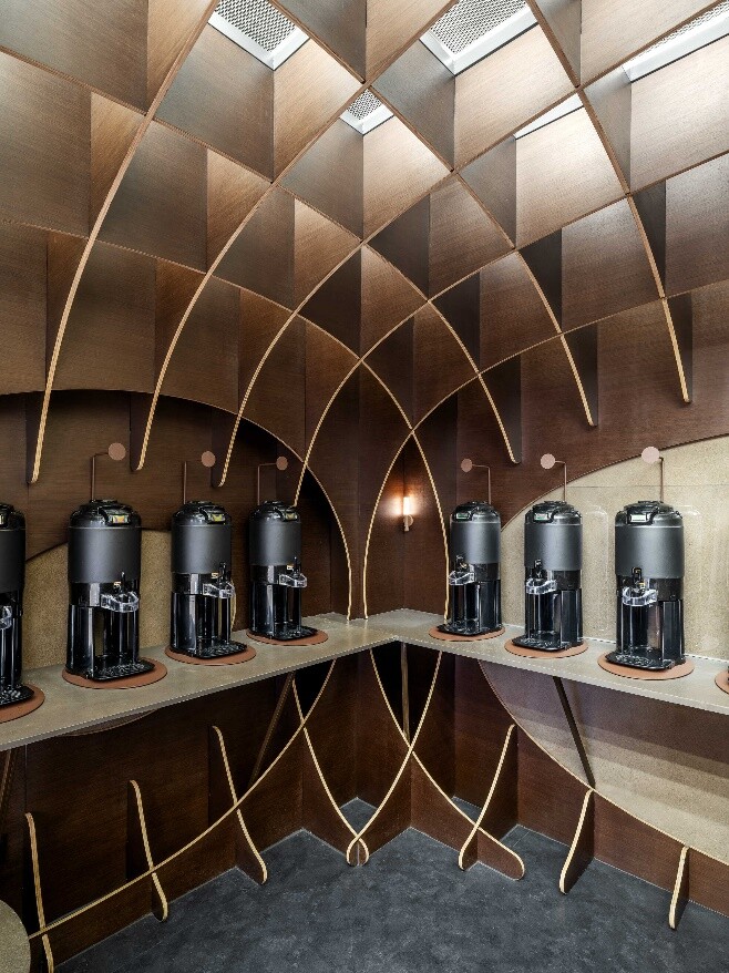 Black coffee equipment wall inside the arched waffle structure, forming an immersive black-coffee experience interface.
