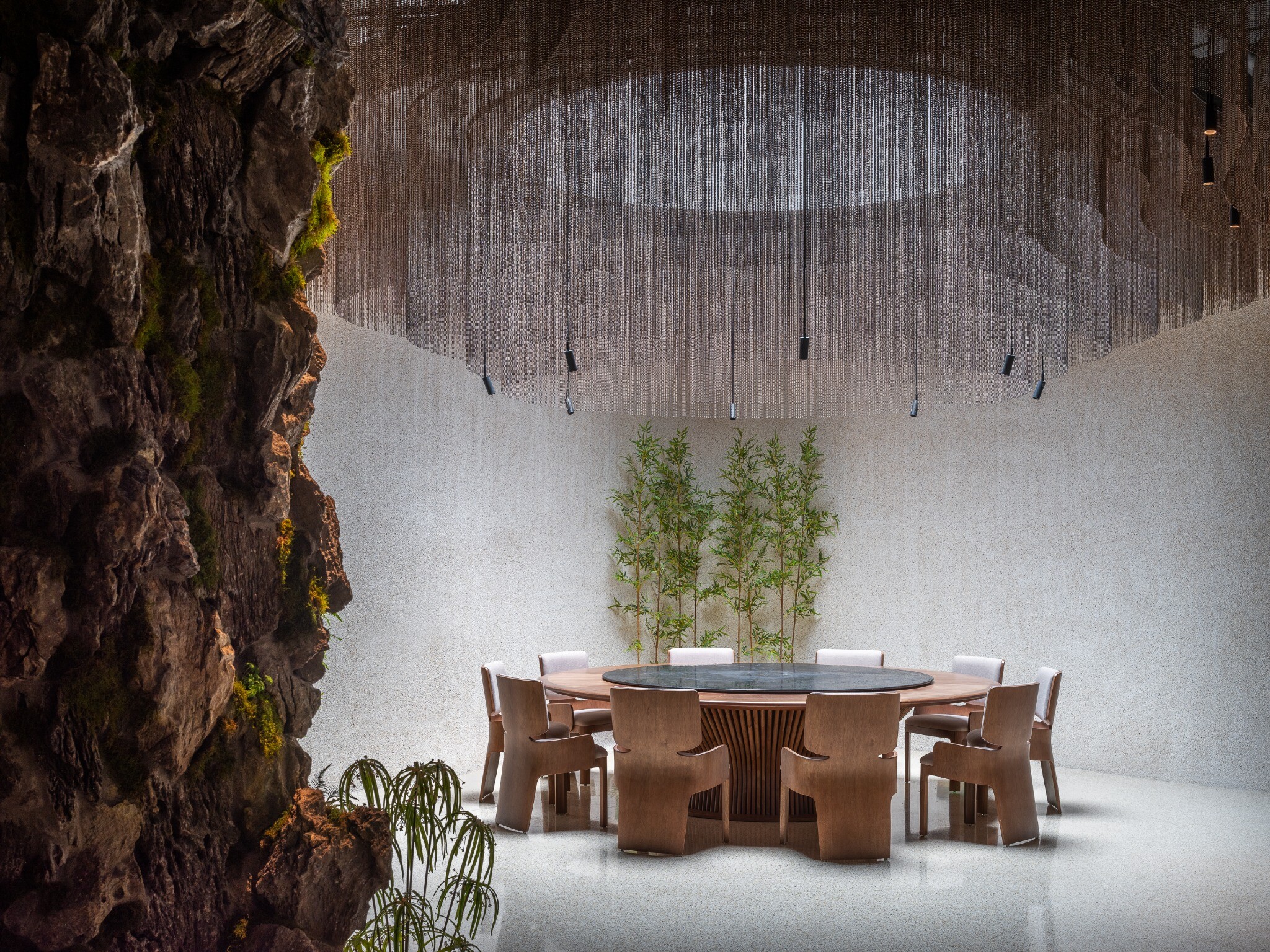 Stone forms, skylight, and bead-curtain mist installation inside the large private room of YiXing YU Restaurant.